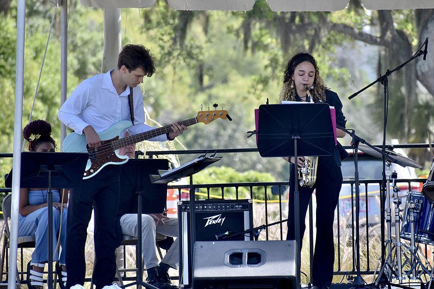 Noah White and Mia Miles perform with Fourcast.