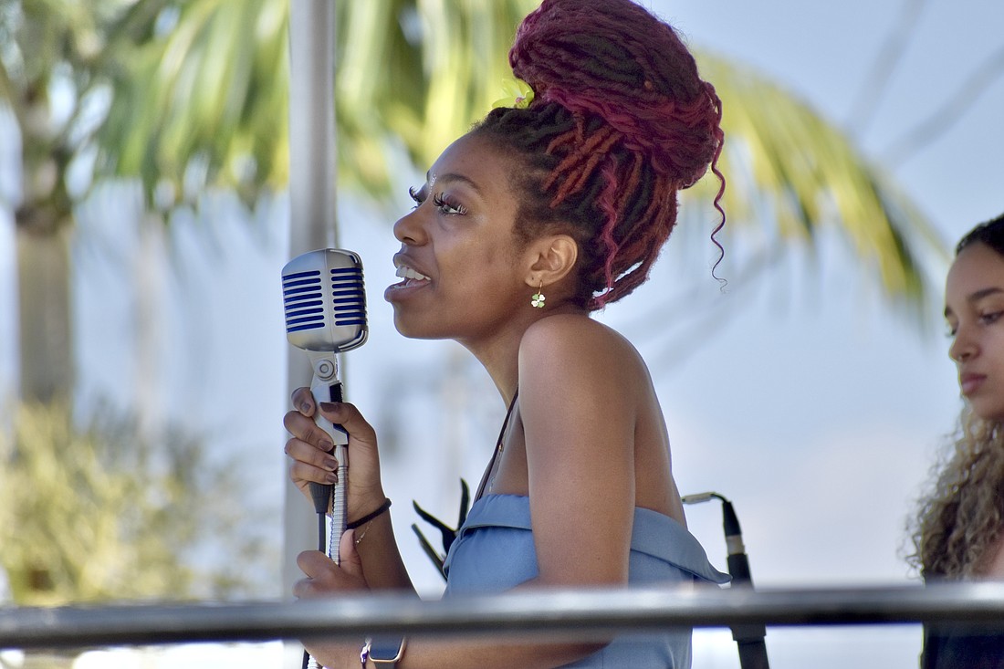 Lillia Jones offers a vocal performance with Fourcast.