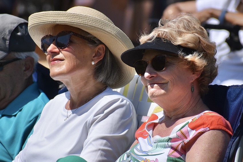 Denise Ciferno and Donna Miles watch the performance by Booker High School students.