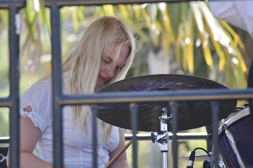 Lily Smith performs on drums with Fourcast.