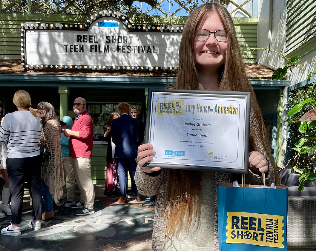 Jaylee Graham with her award outside the theater.