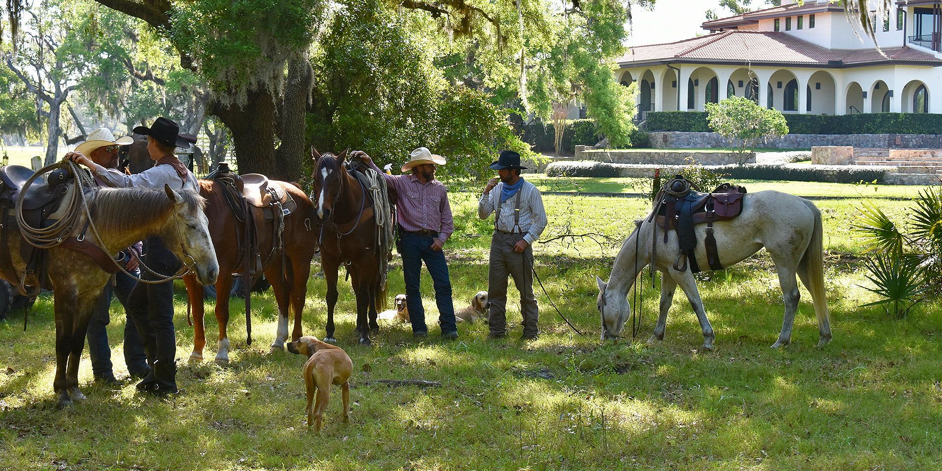 Extras for "Florida Wild" wait off set with their horses and dogs.