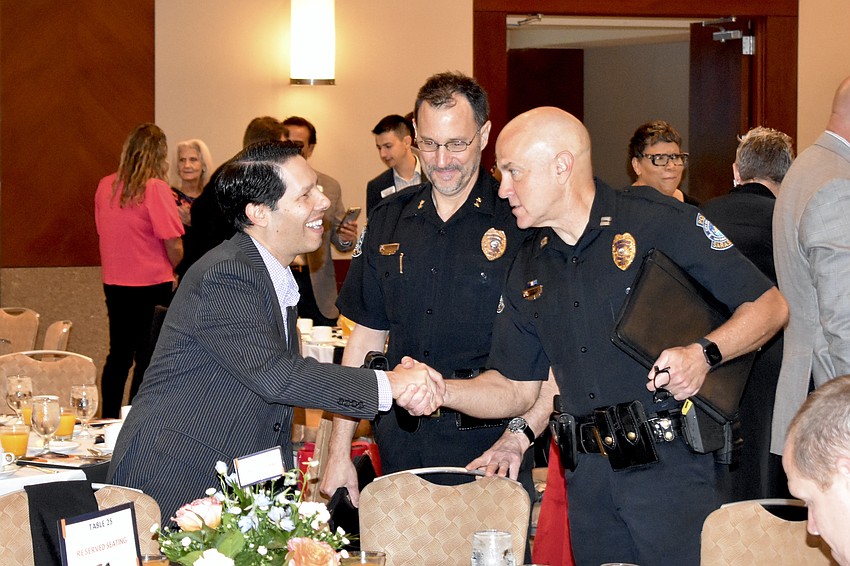 Brian Hersh greets Scott Mayforth and Demetri Konstantopoulos