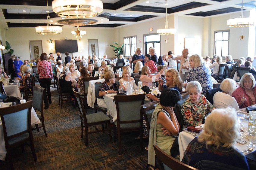 River Strand fashion show guests are ready for lunch and to see the latest fashion available from Wish Boutique.