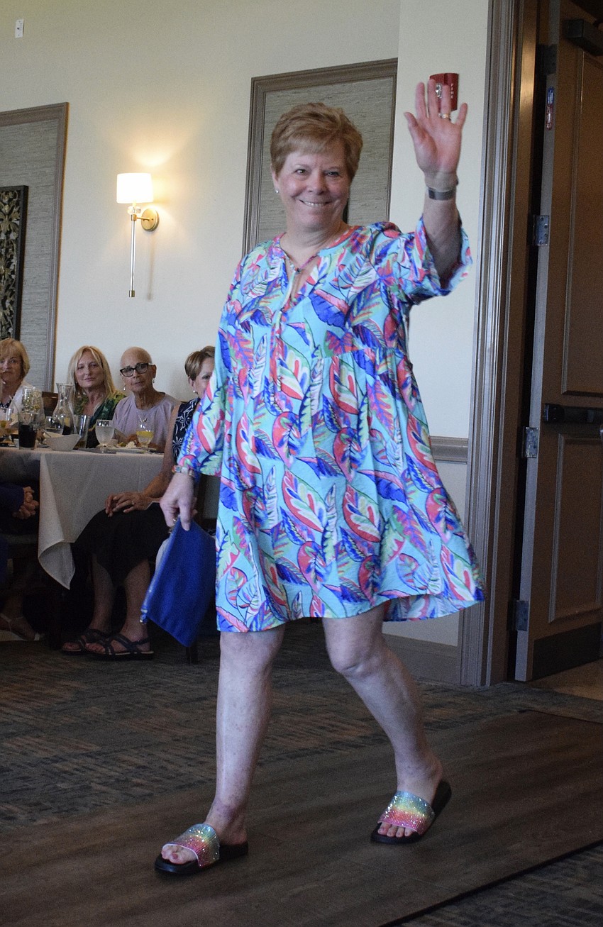 River Strand's Robbie Phaneuf waves to her friends as she makes her way down the runway for the first time.