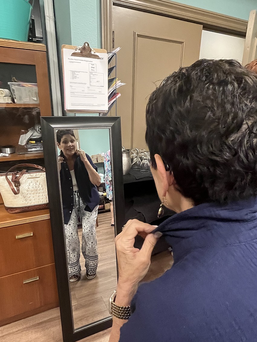 River Strand's Peggy O'Shaughnessy takes a final look in the mirror to make sure she's runway ready.