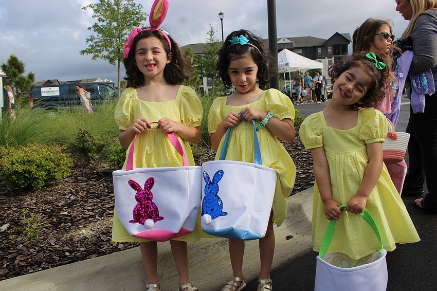 7-year-old Annelise, 5-year-old Evelyn and 3-year-old Isabel McLaughlin of Lakewood Ranch prepare for the start of Eggstravaganza.