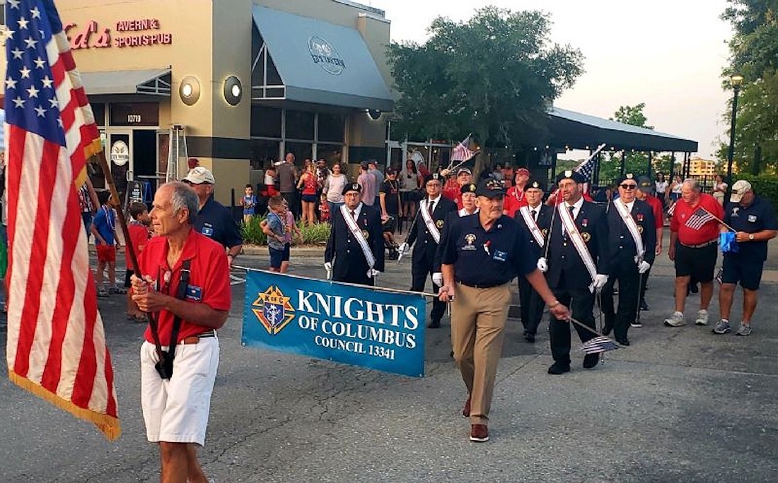 Knights of Columbus council members march in the 2023 Tribute to Heroes Parade.