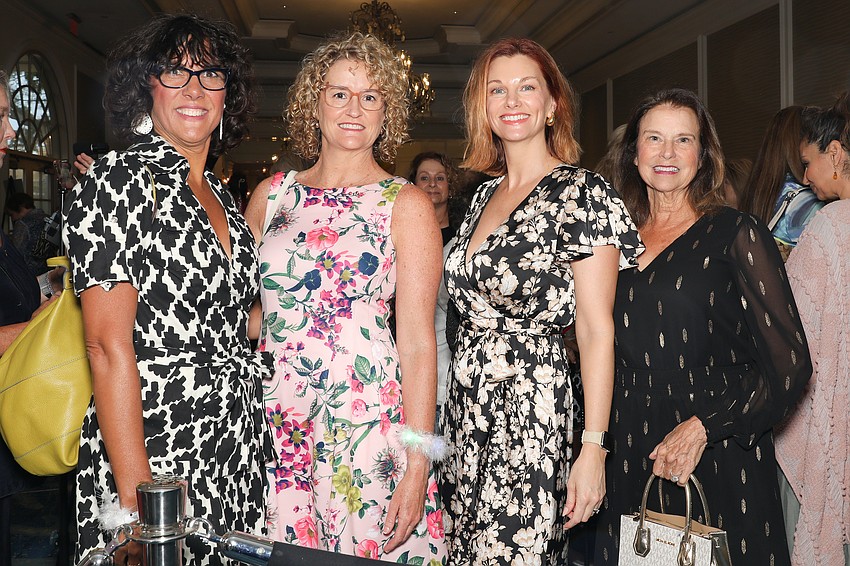 Angie Vaughan, Jen Reichart, Molly Bollore, and Marie Sparks shop with enthusiasm.