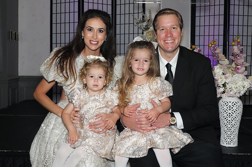 Art in the Dark co-chairs are Veronika and Dr. Philip Ames, with their daughters, Mila and Vivian