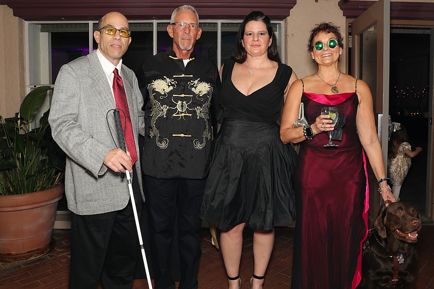 Jonathan Warren, Bill DeVane, Isha Nelson and Lighthouse CEO Alex Elman Foley, with her seeing eye dog, Izmir.