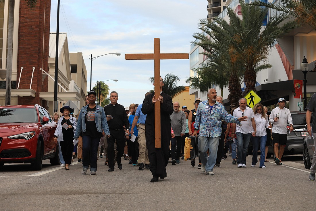 The Rev. David Svihel, priest associate for Christian formation and outreach at Church of the Redeemer, leads the walk.