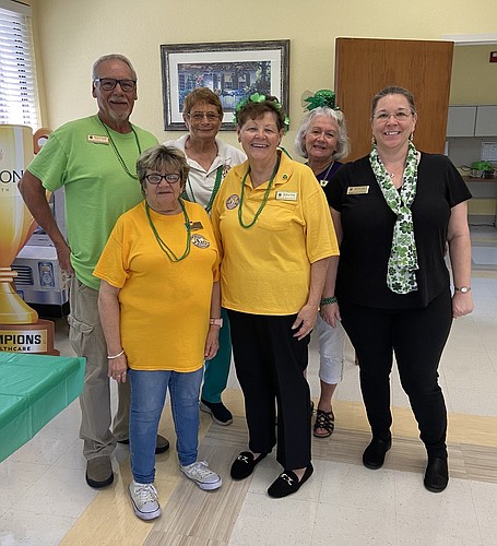 Lions Richard Snyder, Jean Cerullo, Mary Yochum, Bobbie Cheh, Carol Snyder and Melinda Uebel help Coquina Rehab Center residents celebrate St. Patrick's Day. Courtesy photo