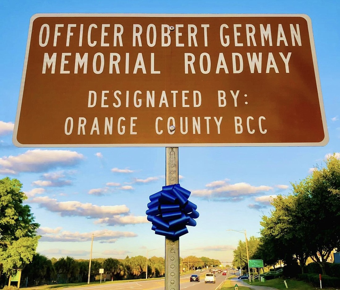 The Orange County Board of County Commissioners unveiled a roadway sign tribute to officer Robert “Robbie” German in 2015.