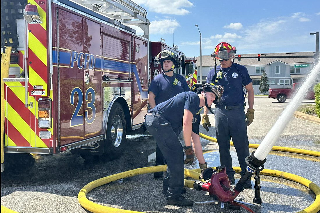 PCFD Firefighters in a training exercise. Photo courtesy of the PCFD