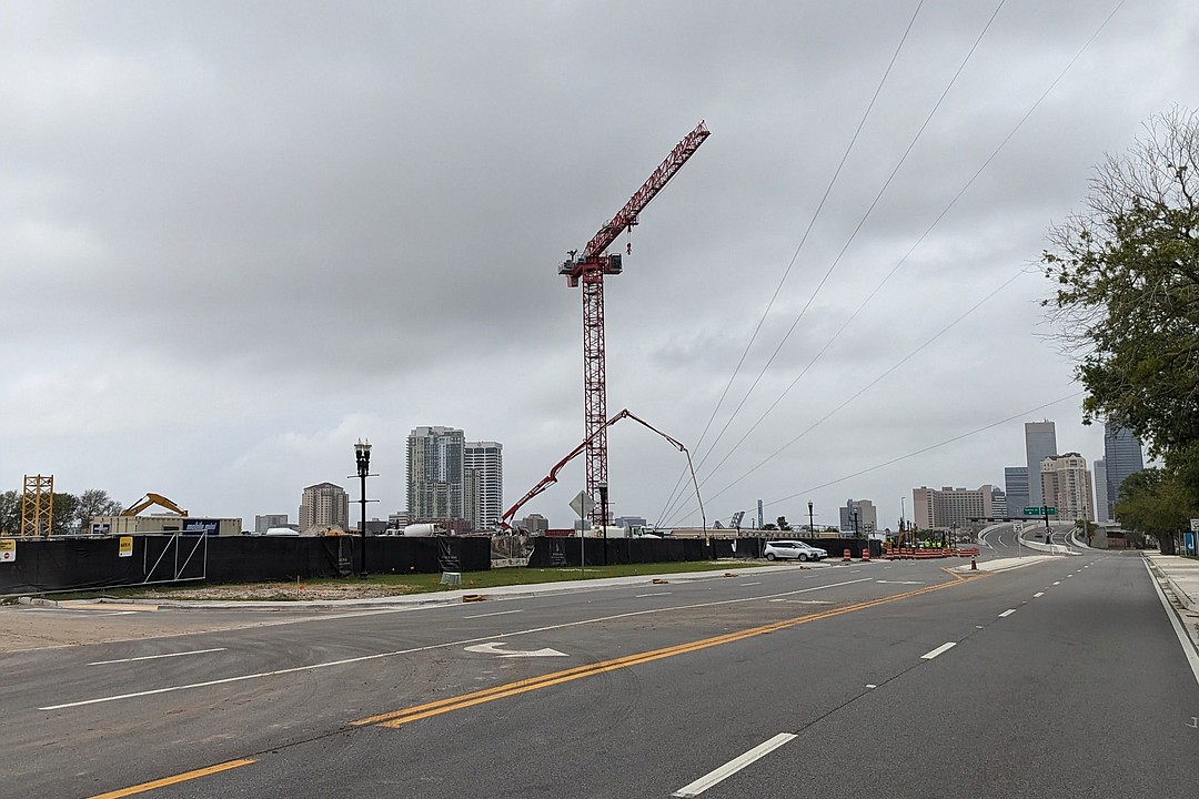 Cranes mean construction at Jacksonville Jaguars’ riverfront office building and Four Seasons Hotel and Residences