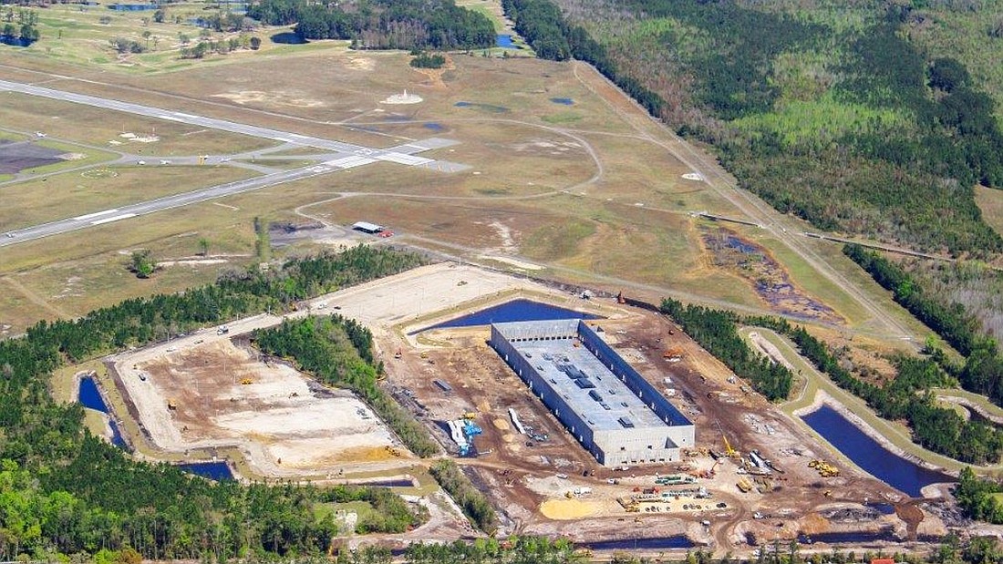 An aerial view of construction of the Amazon warehouse at Jacksonville Executive at Craig Airport.