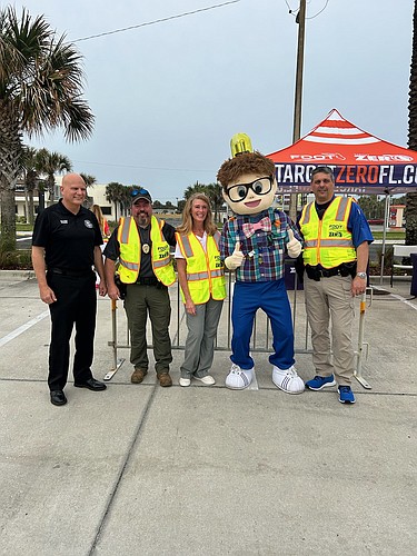 Ormond Beach Fire Chief Howard Bailey, Ormond Beach Police Capt. DW Smith, City Commissioner Lori Tolland, Alert Tonight Florida mascot Walker and Police Capt. Chris Roos. Courtesy photo