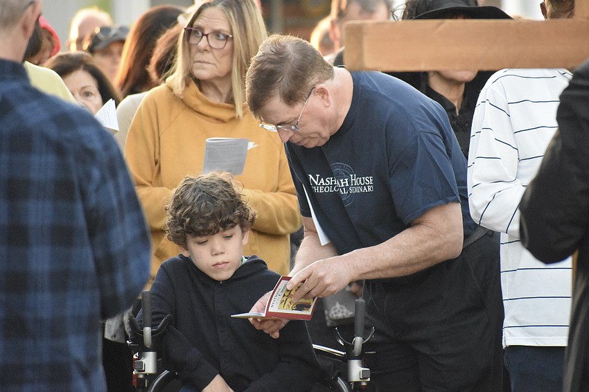 Joshua Santos, 14, and his father Fernando Santos, came from Cathedral Church of Saint Luke in Orlando to attend the walk.