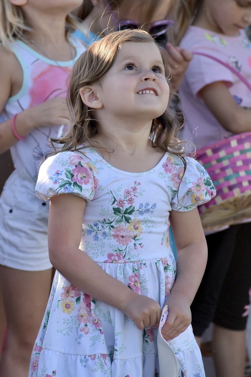 Lennon Walen, 3, eagerly awaits the arrival of the helicopter.