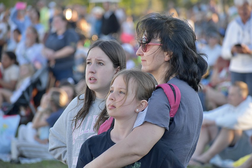 Audri Wallin, 12, Sierra Mullin, 8 and Alalia Mark watch Nik Wallenda walk the tightrope.