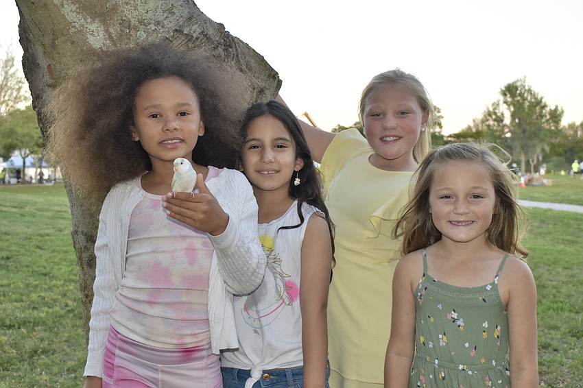 Halo Izear, 8 and her bird Blueberry, Abriana Navarro, 6, Nora Miller, 8 and Nyah Miller, 6