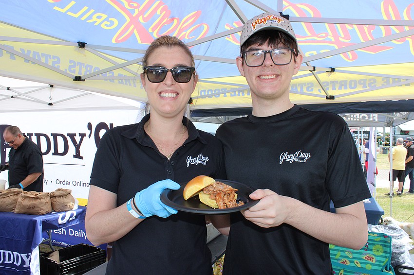 Casey Pfabe and her son Cort Pfabe were serving pulled pork, a customer favorite at Glory Days Grill during Hometown Fest.