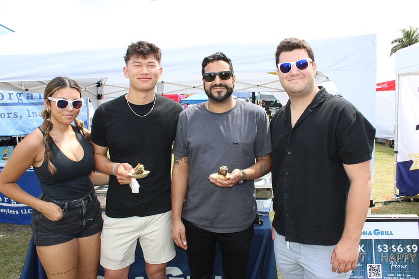 Kona Grill's Isabella Morales, Luke Warrington, Jose Nurura, and Kyle Wampler are ready to hand out ribeye meatballs. Nurura, a corporate trainer, says such festivals are great for 