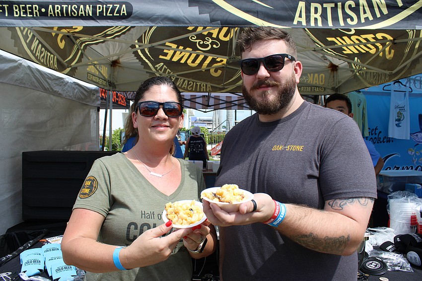 Heather King and Dan Williams, a pair of general managers for Oak and Stone, say their oven baked mac and cheese has been a beloved staple dish for the restaurants.