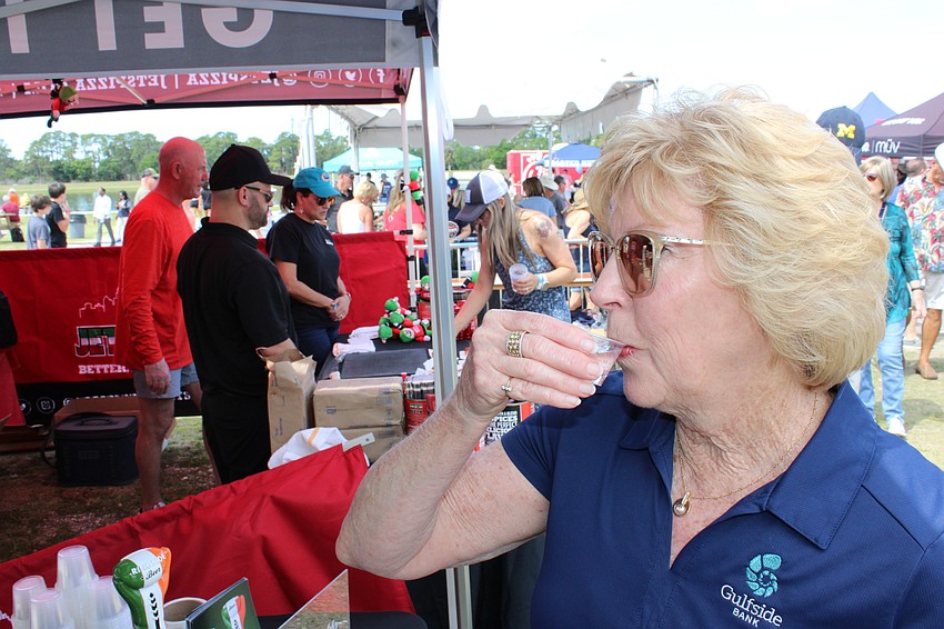 Kathy Collums tries a little Ringside Vodka at My Hometown Fest. Collums says with the different tastings, it was good there was plenty to eat at My Hometown Fest.