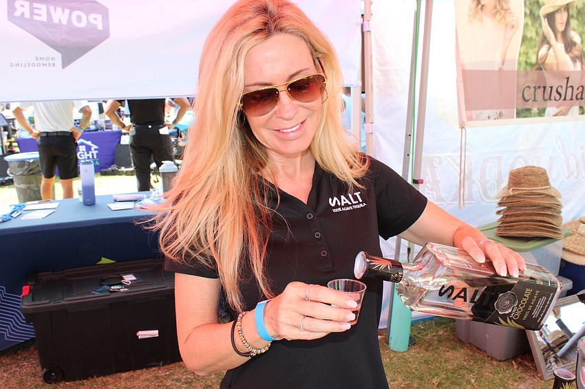 Shawn Lane of the Splash Beverage Group pours Salt Tequila at My Hometown Fest. She says Splash Beverage always is 