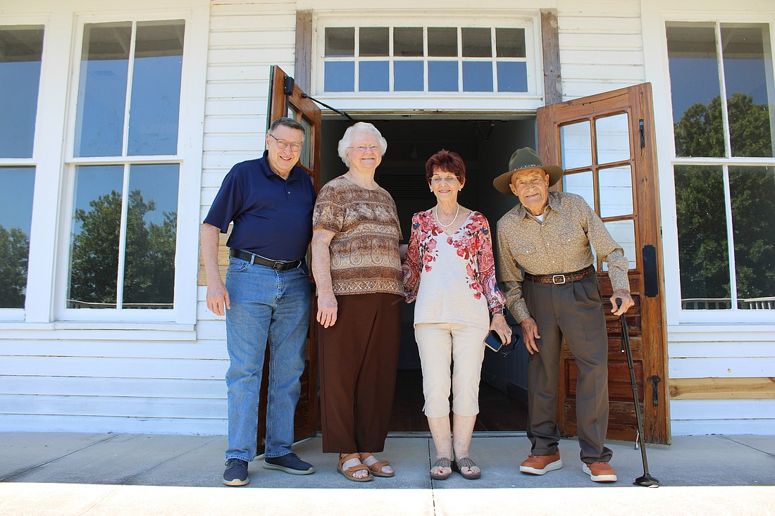 The Myakka City Historical Society's Walter Carlton and Marilyn Coker talk to "major donors" Barbara and Bob Anson about the Myakka City Historic School House project.