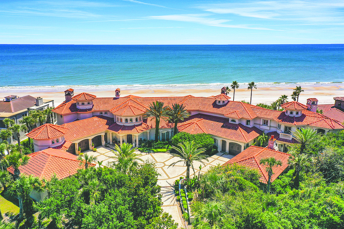 Oceanfront two-story home features six bedrooms, seven full and three half-bathrooms, office, wine cellar, pool, six-car garage and dune walkover.