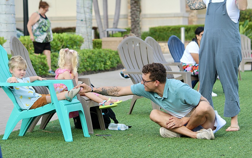 Dad Noah Powers coaxes Noah and Clementine to play.
