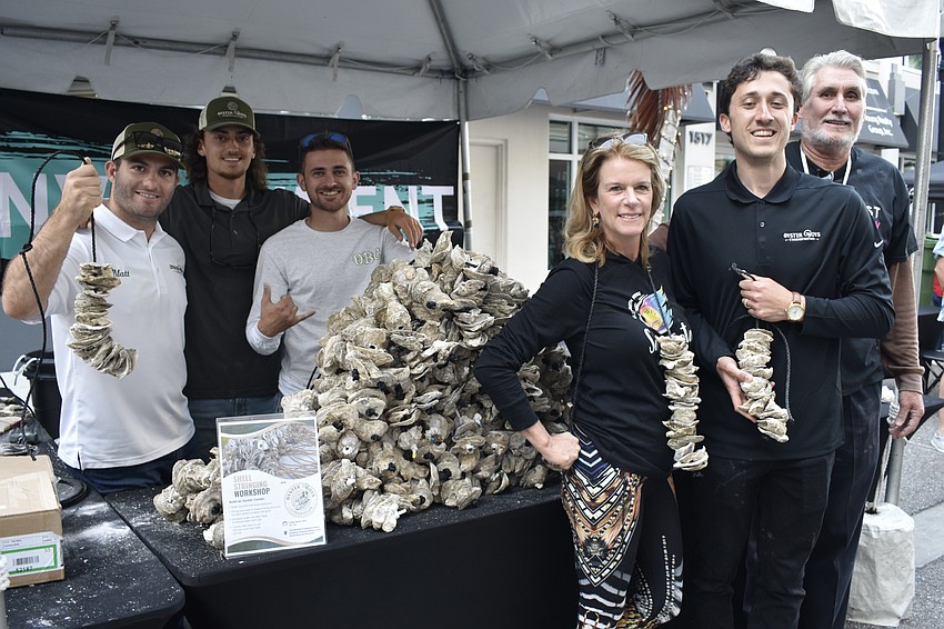 Matt DeMasi, Vince Marino, Sam Jeffcoat, Elizabeth Moore, Dom Marino and Jon Thaxton. Event guests created a stack of over 100 vertical oyster gardens for Oyster Boys Conservation.