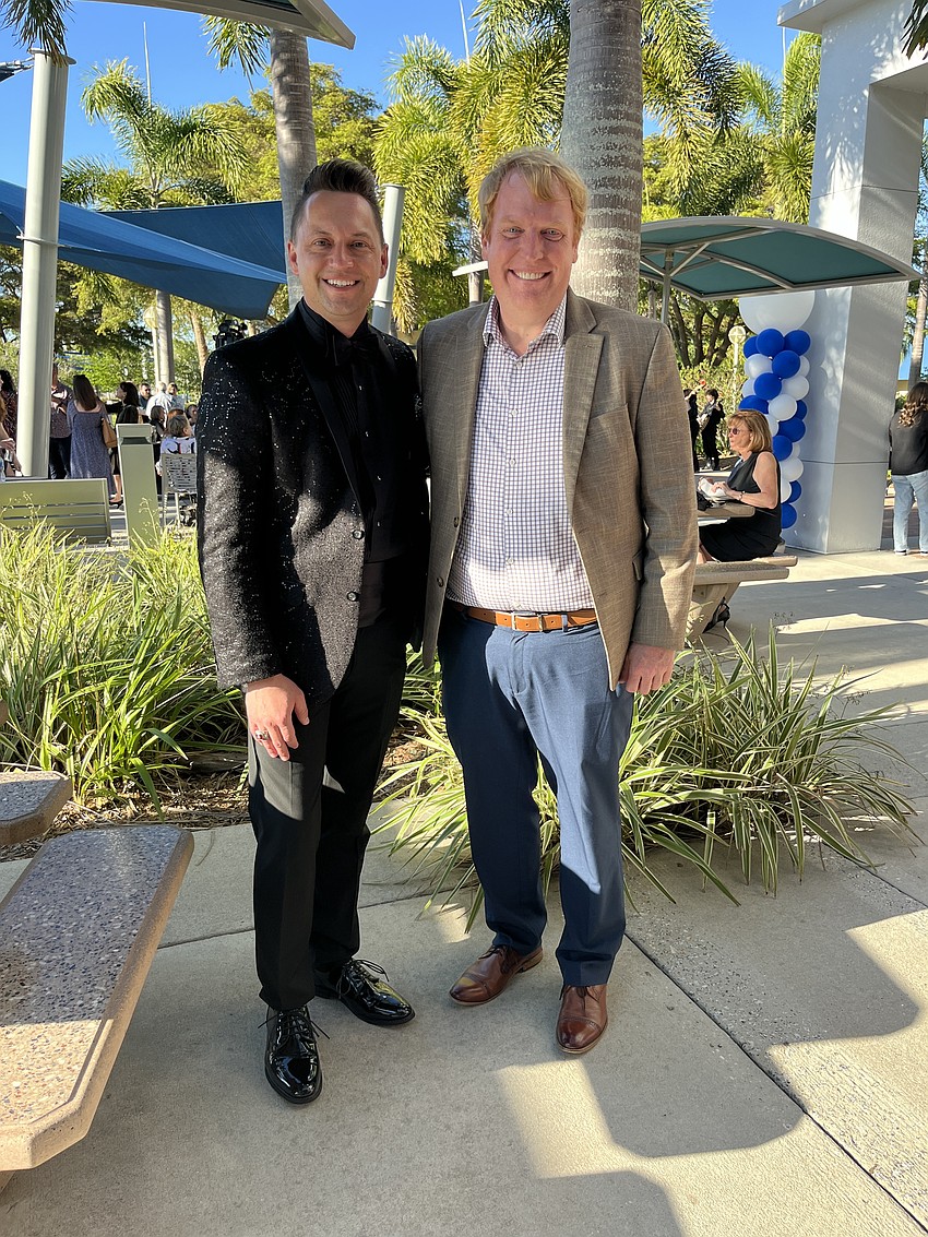 Jeramiah Bowman, the chairperson of the Manatee Arts Education Council, welcomes Jason Wysong, the superintendent of the School District of Manatee County, to Arts Alive, which showcases students' artwork and performances as well as honors community members in the arts.