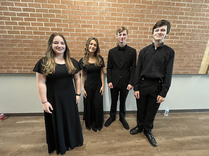 Braden River High School sophomore Alexa Helton, seniors Nyah Platt and Nick Teta and junior Matthew Bowers come together as a clarinet quartet. Platt says it's fun working with the members of the quartet.