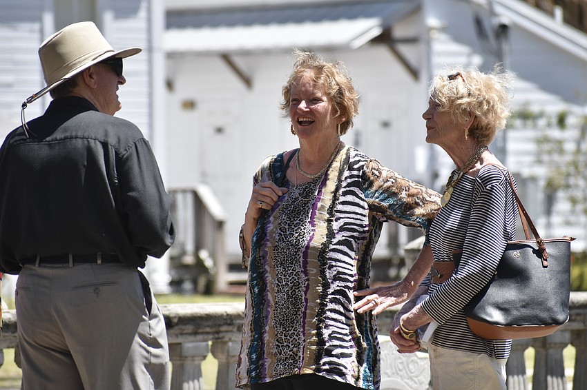 John Manning of the Sarasota County Historical Commission offers a tour of the Whitaker Cemetery to a group that includes Lorraine Traina and Robin Robertson.