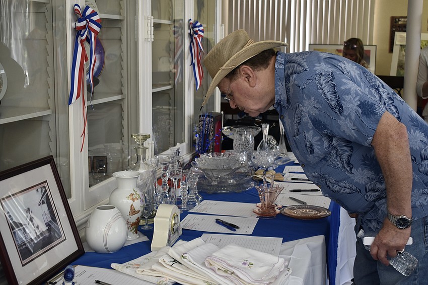 Rich Rizzo, a former history teacher, browses the items on display inside the DAR Chapter House.