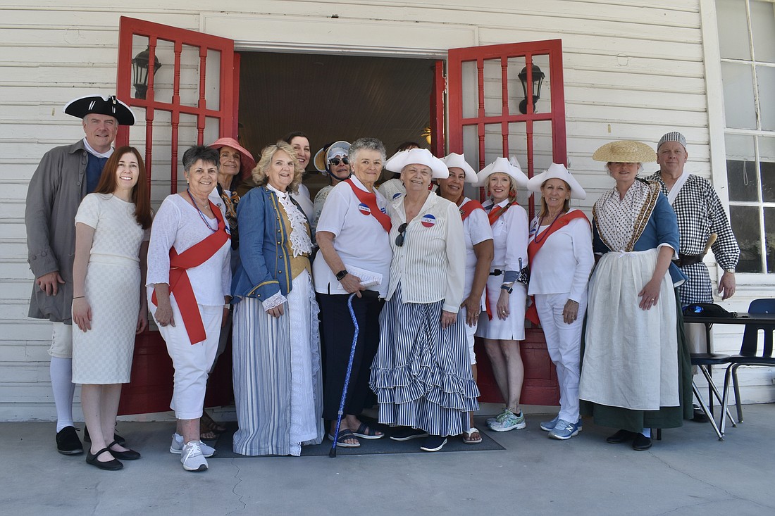 Daughters of the American Revolution and Sons of the American Revolution members gather outside the Crocker Memorial Church.