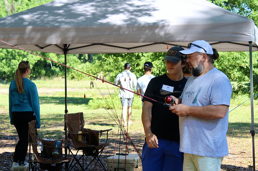 Roman Olievskiy Jr. and Roman Olievsky Sr. brush up on their casting skills.