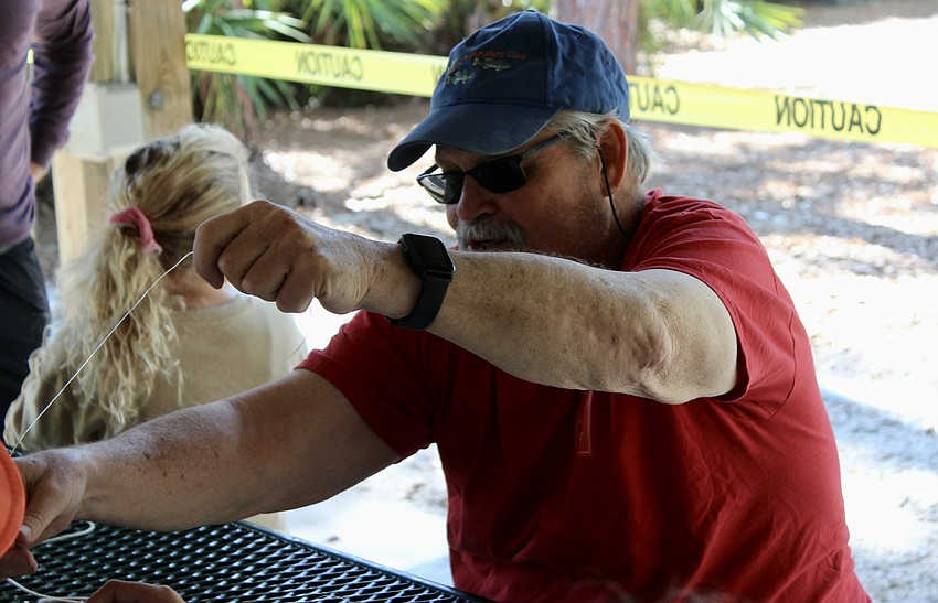 Joe Kaminsky teaches the kids how to tie knots.