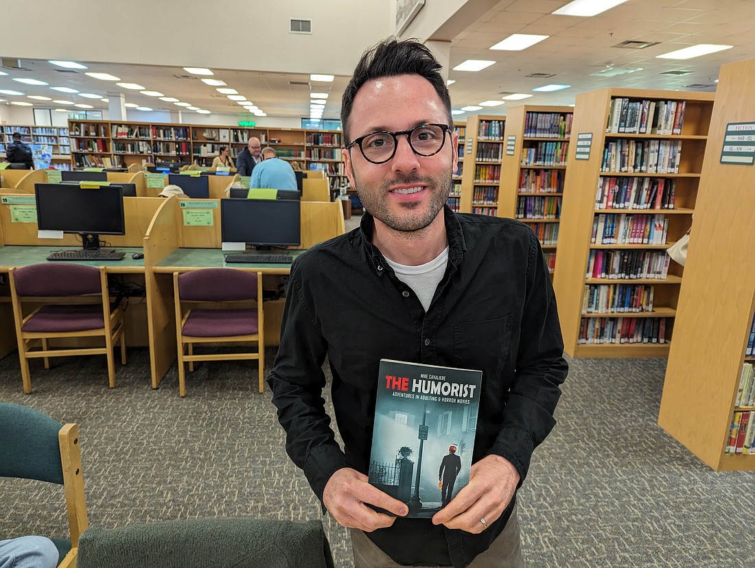 Mike Cavaliere, who wrote "The Humorist, Adventures in Adulting & Horror Movies", was one of the local authors who participated in Book Fest 2024 at the Flagler County Public Library in Palm Coast. Photo by Brent Woronoff