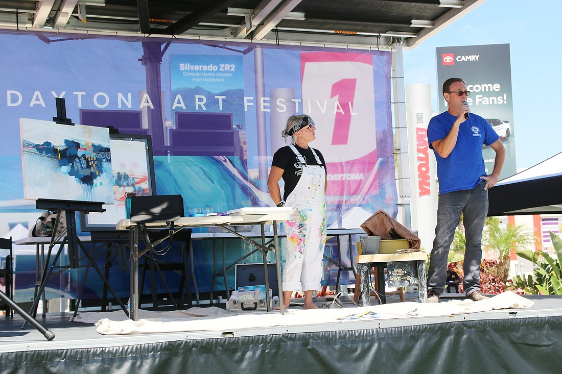 Stacey Fletcher Reynolds and Trent Berning, art professors at Daytona State College, hold a live art demonstration during the 2024 One Daytona Art Festival, held Saturday and Sunday, April 6-7. Photo by Jarleene Almenas