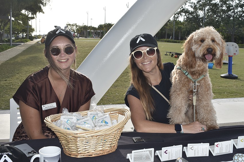 Rachel Ploss and Kinsey Robb of Art Center Sarasota, and Robb's dog Lola