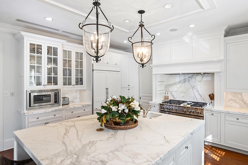 Built in 2008 by Perrone Construction, it features 12-foot ceilings, marble countertops, and a marble fireplace.