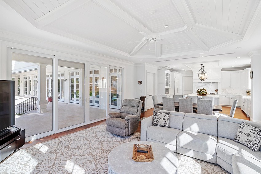 The outdoor patios and balconies oversee a deck, new pool, spa, and manicured grounds.