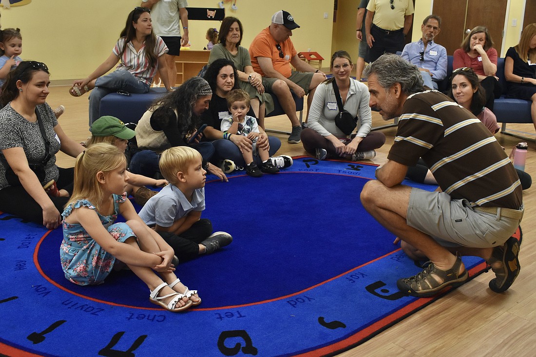Rabbi Brenner Glickman speaks to the group about Passover.