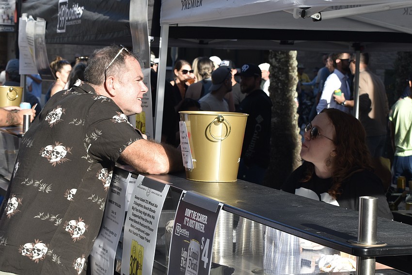 Christopher Prendergast purchases a drink from Megan Murphy