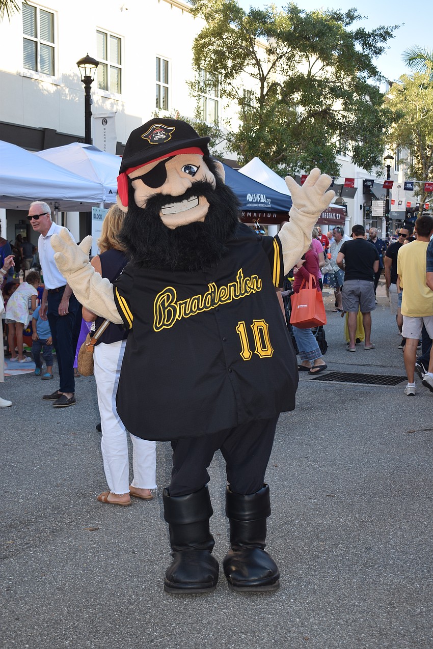 Marty the Marauder makes his way around Main Street at Lakewood Ranch giving people fist bumps.